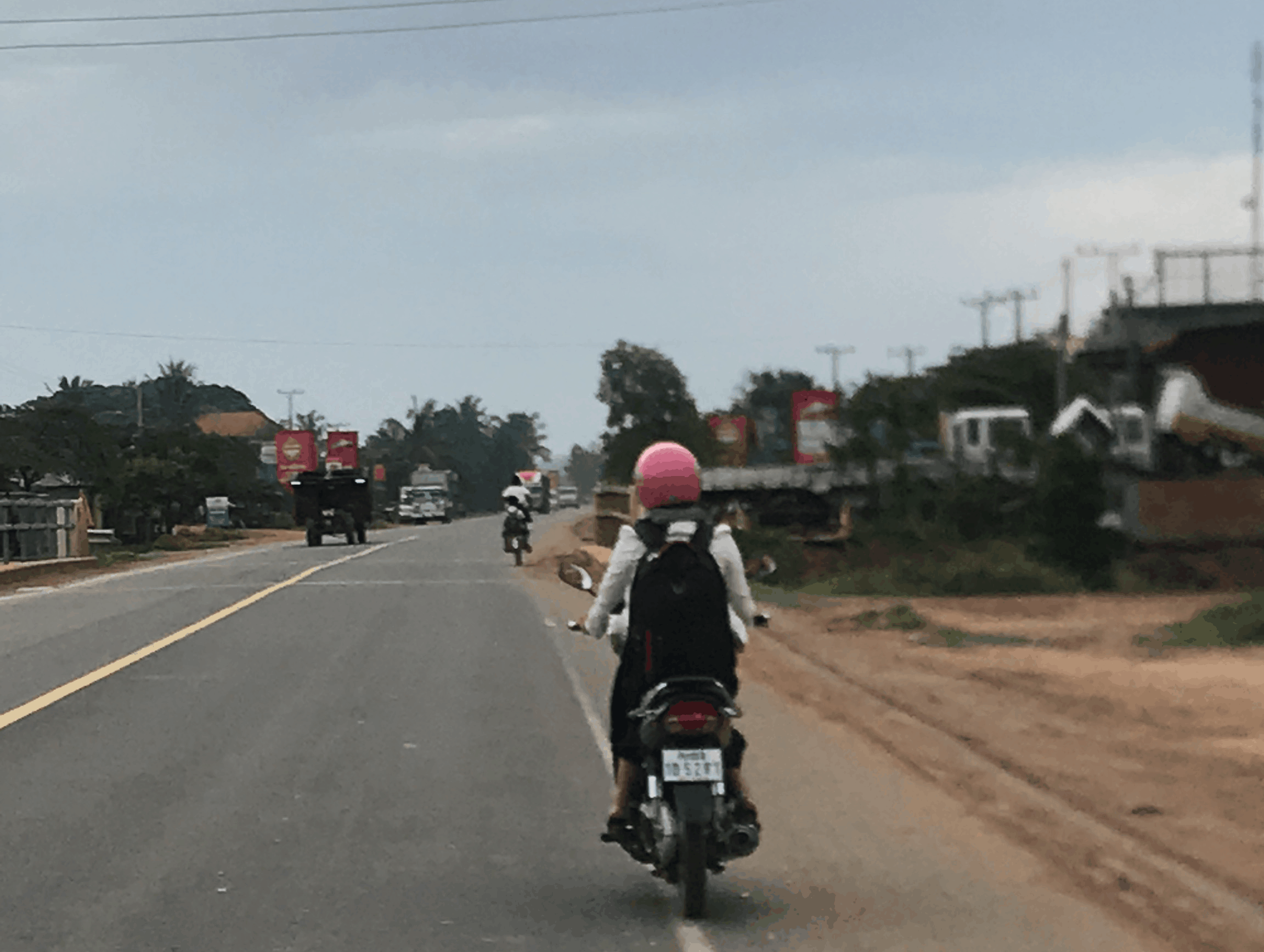 Ms. Kong travels by motorbike to her assigned schools in Kampong Thom province.