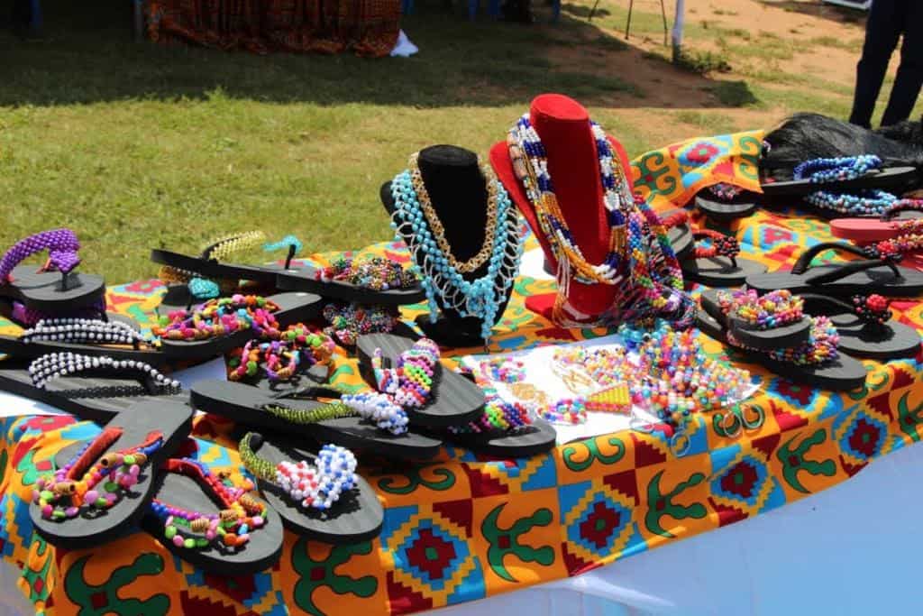 A local artisan, Madam Anafor Veronica, trained Regina and five of her peers to make beads, sandals and other products.