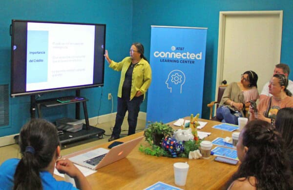 A woman presenting in front of a group