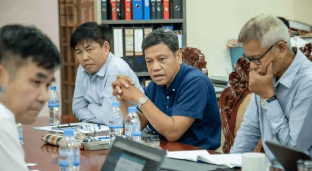 Stakeholders in Cambodia sit at a table planning for the next phase of the Digital Education program