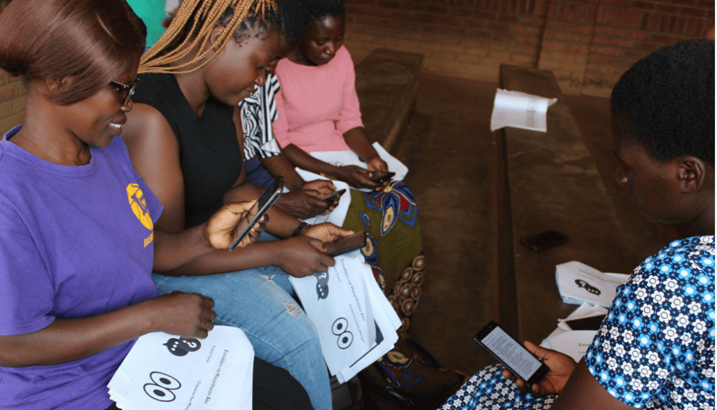 Women in Malawi use Adobe Liquid Mode on portable devices